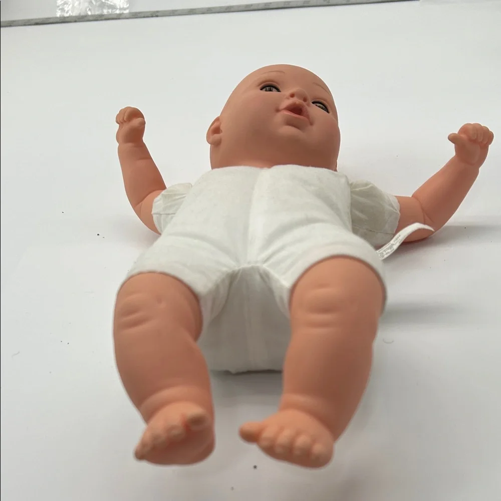 Realistic Baby Doll with White Outfit